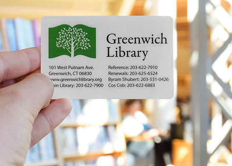 Holding library card